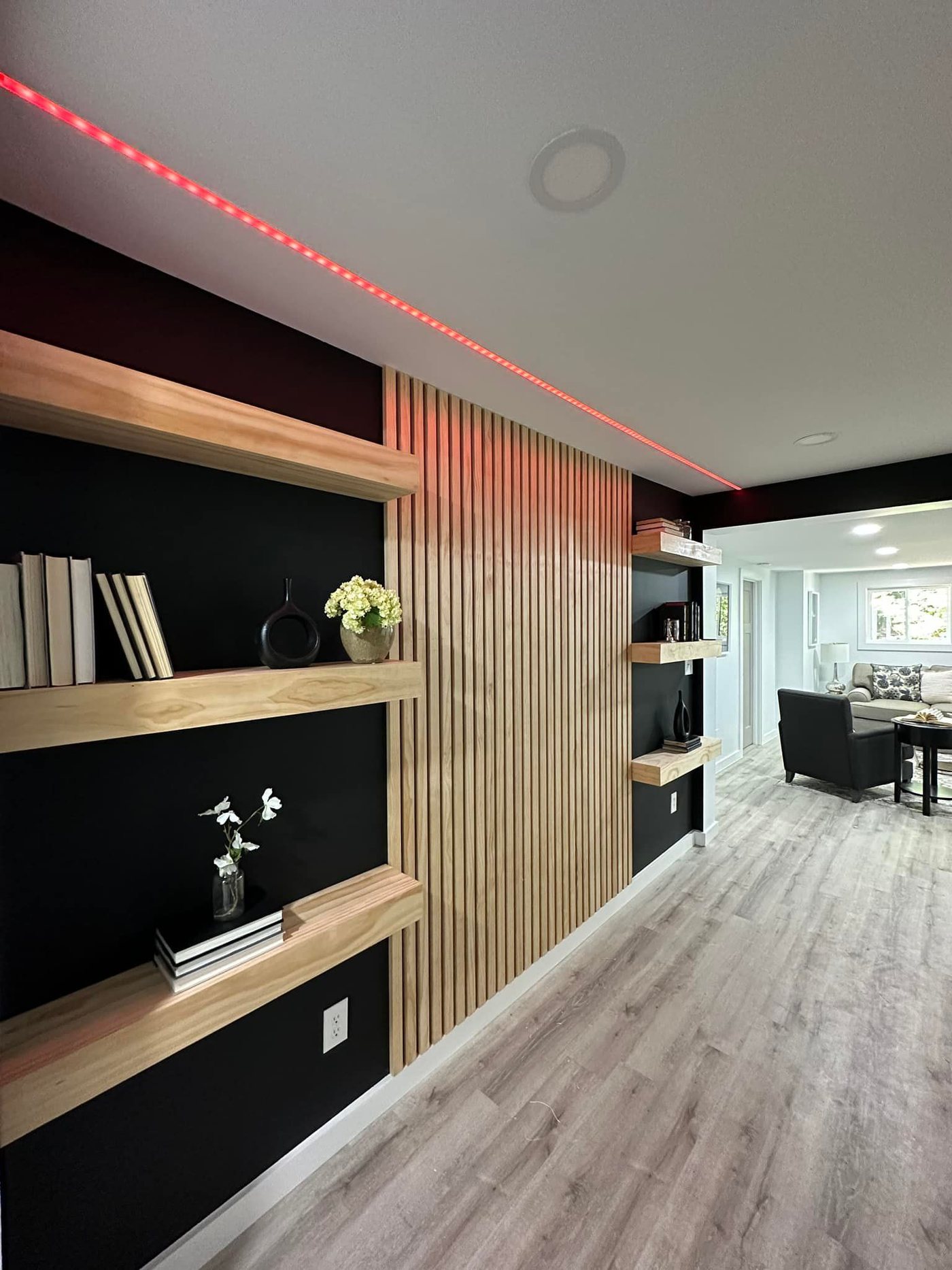 Slat accent wall with LED-lit shelving