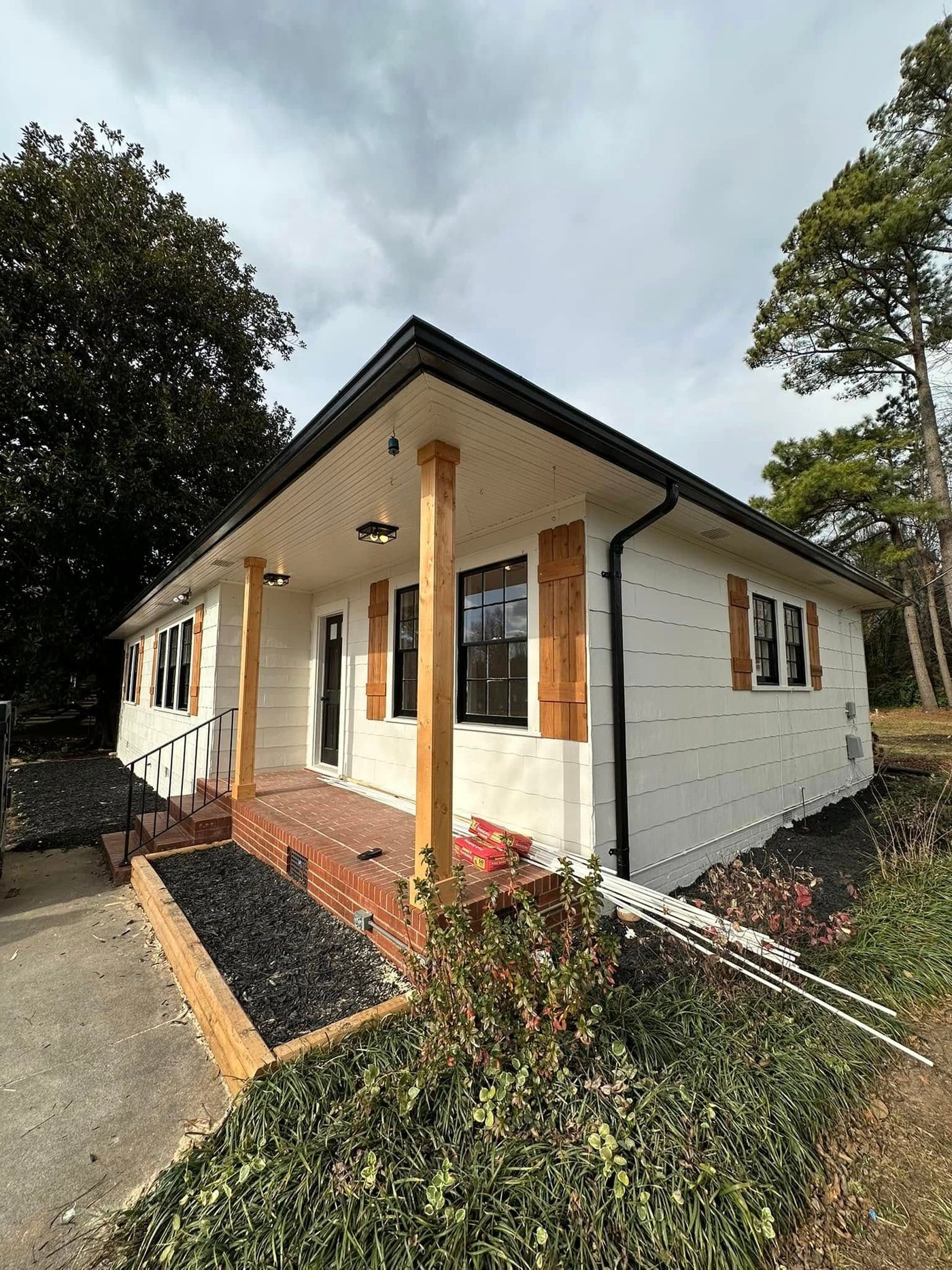 Exterior repaint with cedar porch posts