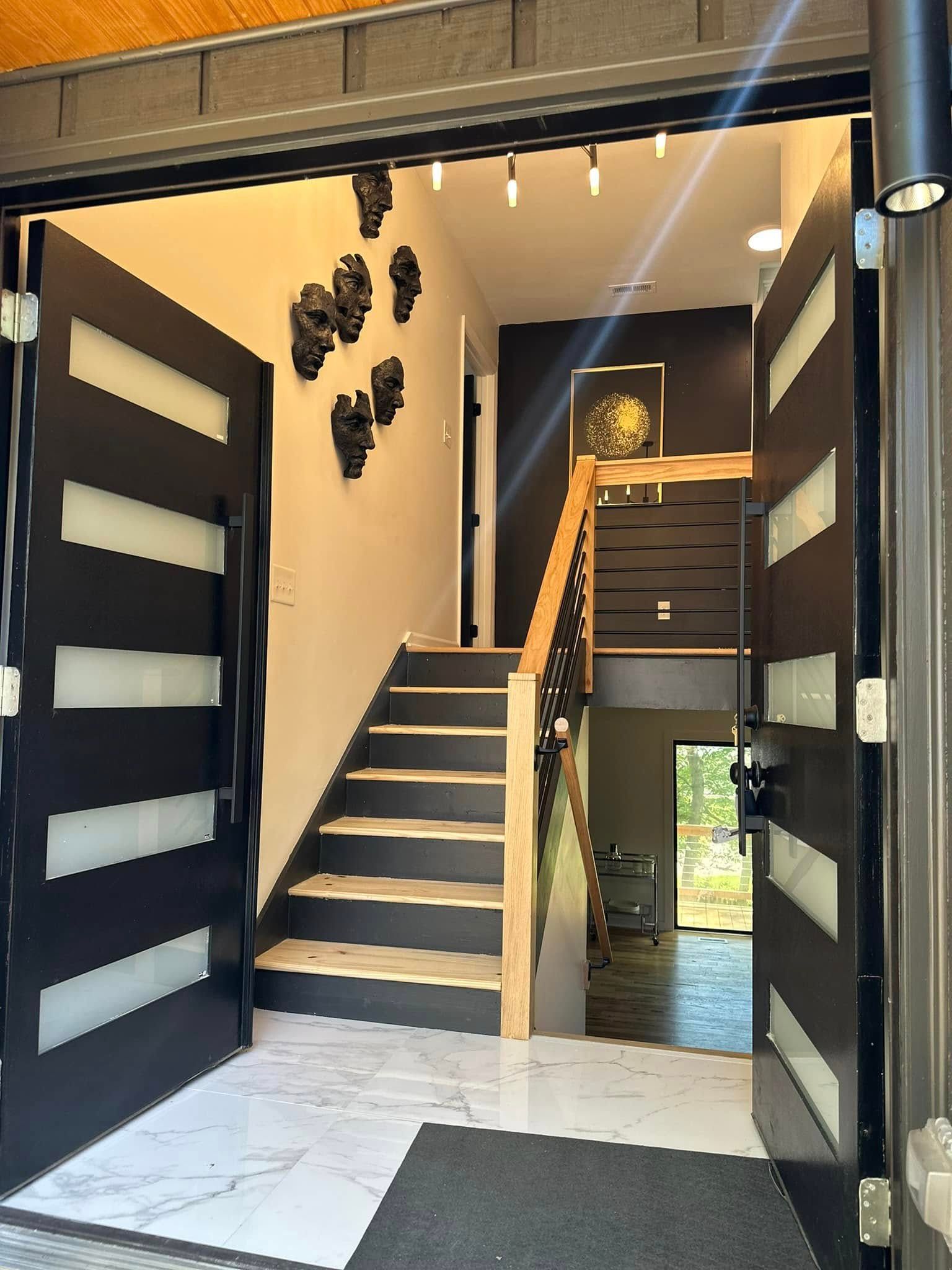 Modern staircase rebuild with black balusters
